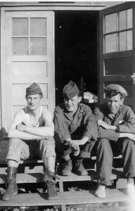 Karl Karpinski, William McGraw, and Sgt Cleo Hamman on the Front Steps of North Wing of the PED Area at Los Alamos, 1946